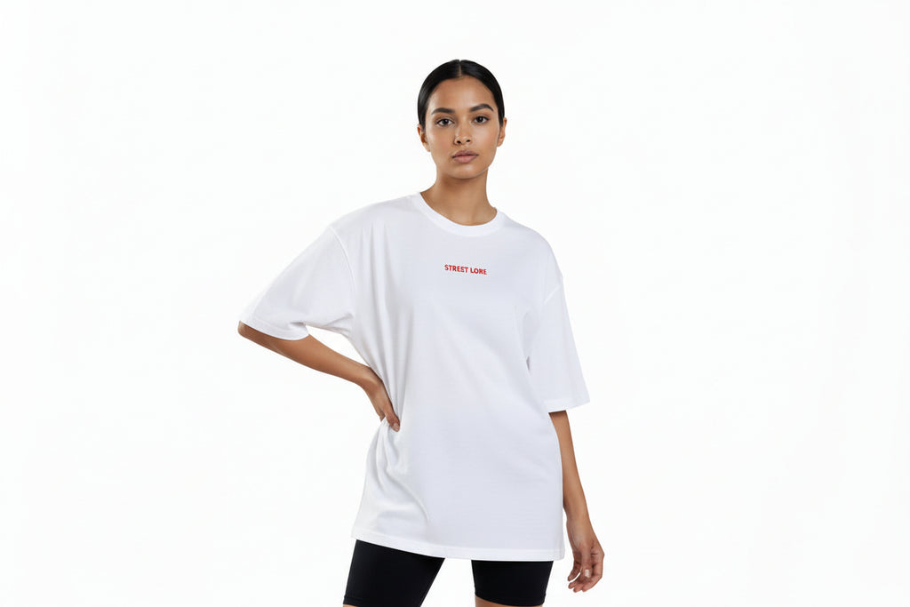 Person wearing a white t-shirt with text on a white background